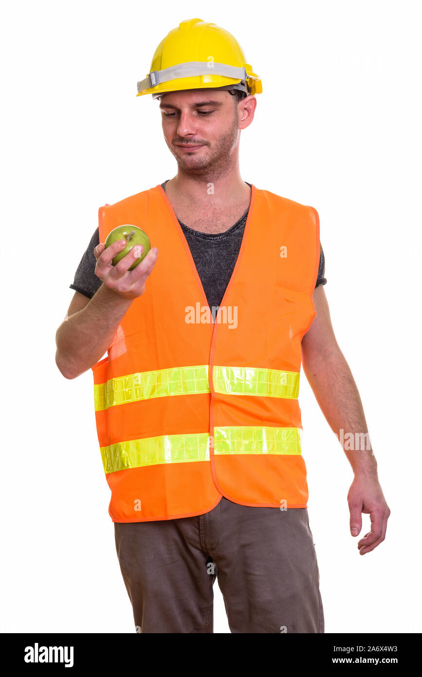 Studio shot des jungen Mannes Bauarbeiter Holding und Suchen Stockfoto