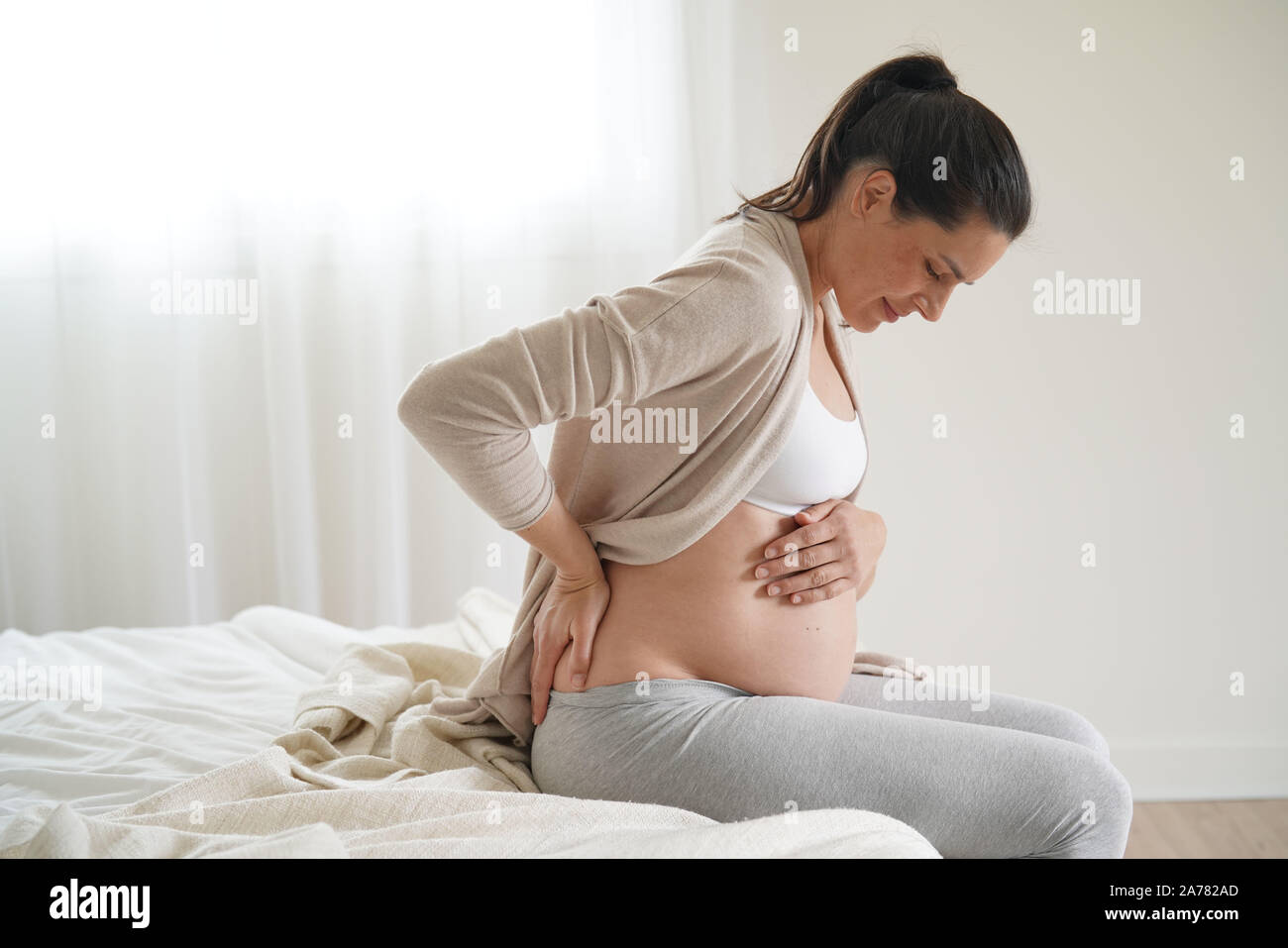 Schwangere Frau Kontraktionen in Stockfoto