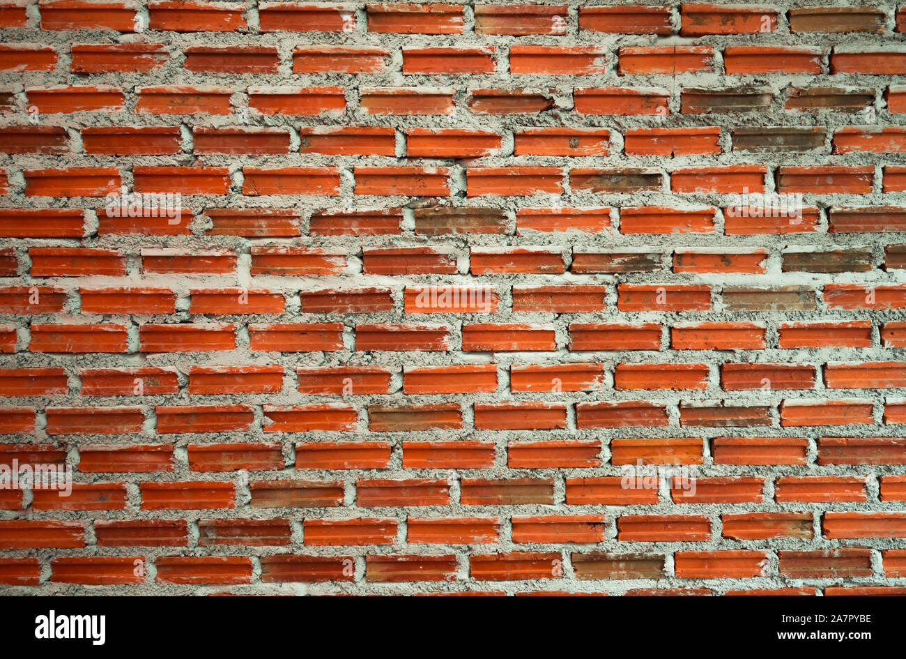 Rot und Orange Wand Textur Hintergrund. Ziegelwerk home Architektur Innenraum. Loft Design von zu Hause. Brick Wall vintage Hintergrund. Mauerwerk Stockfoto