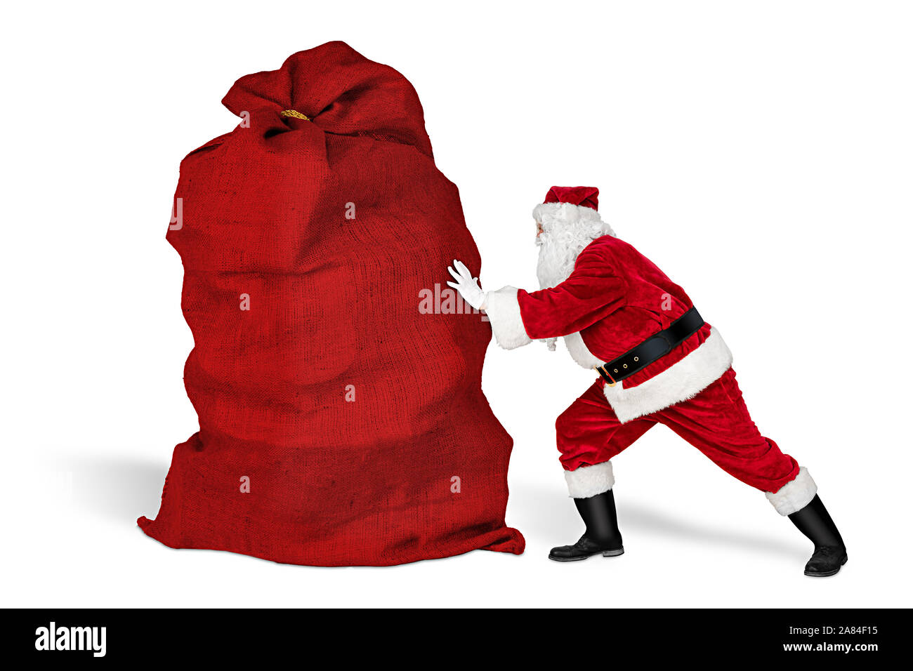 Klassische traditionelle Crazy funny Santa Claus auf anstrengende Lieferservice. Drücken riesige riesige grosse rote Beutel mit Weihnachtsgeschenk auf Wh isoliert vorhanden Stockfoto