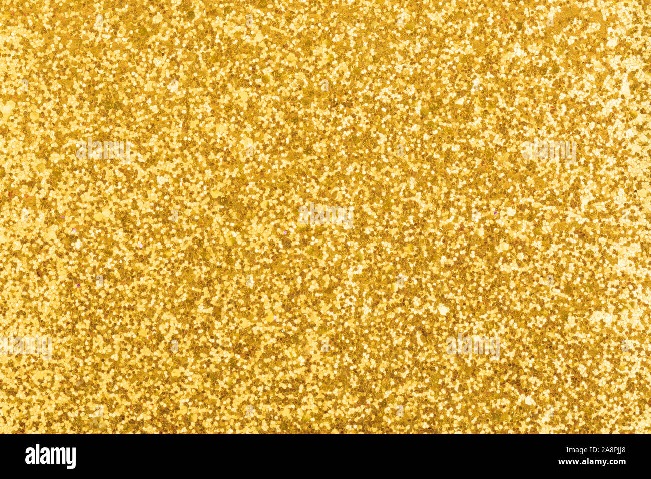 Golden glänzenden und glitzernden Hintergrund Textur. Muster für das Neue Jahr 2020 Karten mit Licht. Stockfoto
