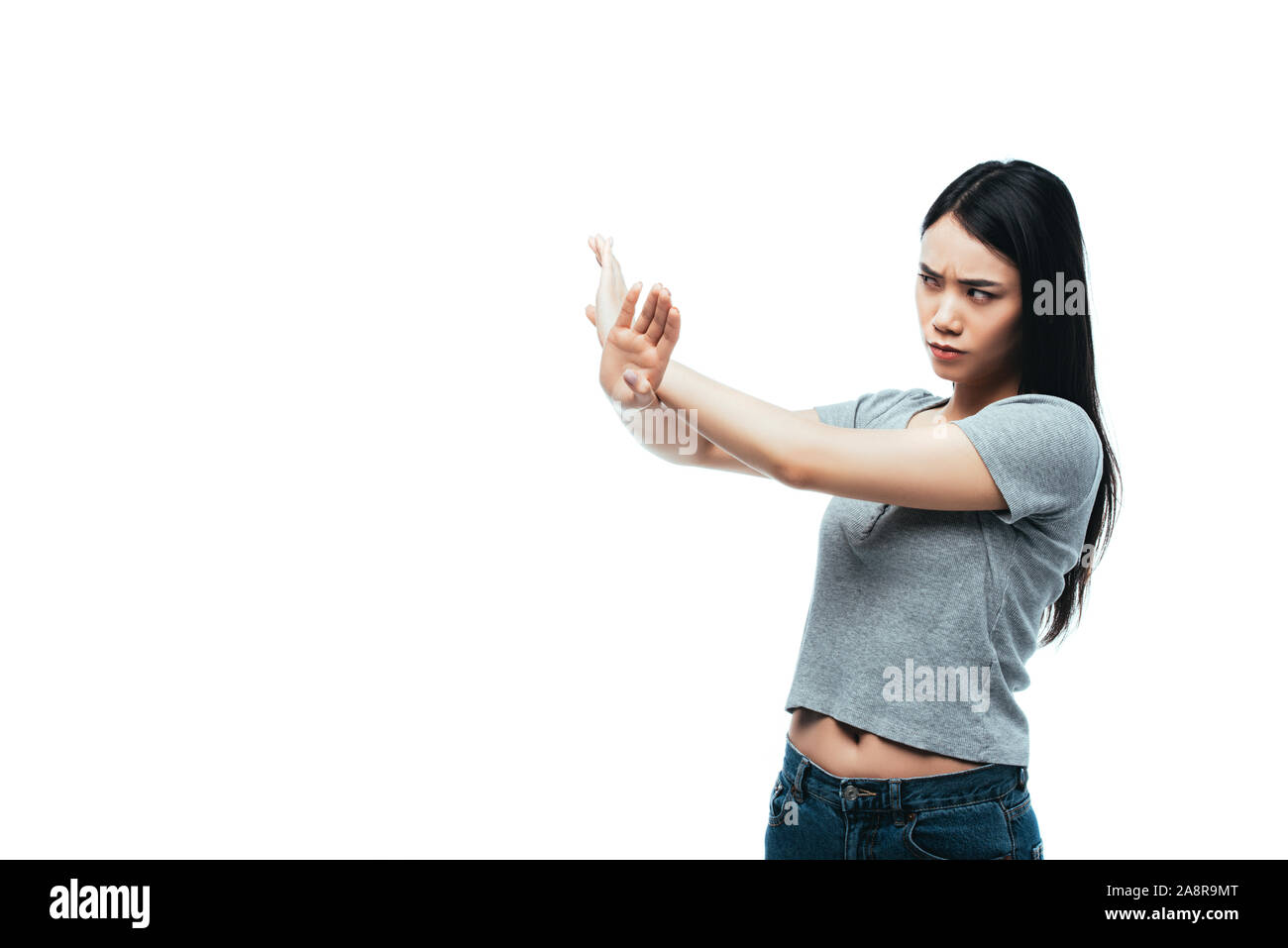 Missfallen asiatischen Mädchen Übersicht stop Geste isoliert auf weißem Stockfoto