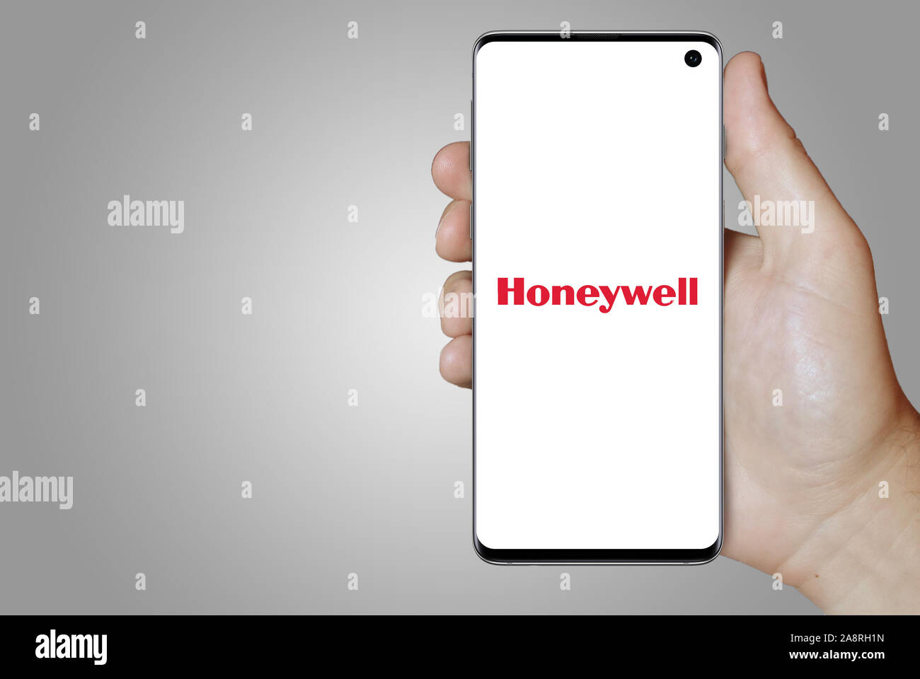 Logo der öffentlichen Unternehmen Honeywell Int'l Inc. auf dem Smartphone angezeigt. Grauer Hintergrund. Credit: PIXDUCE Stockfoto