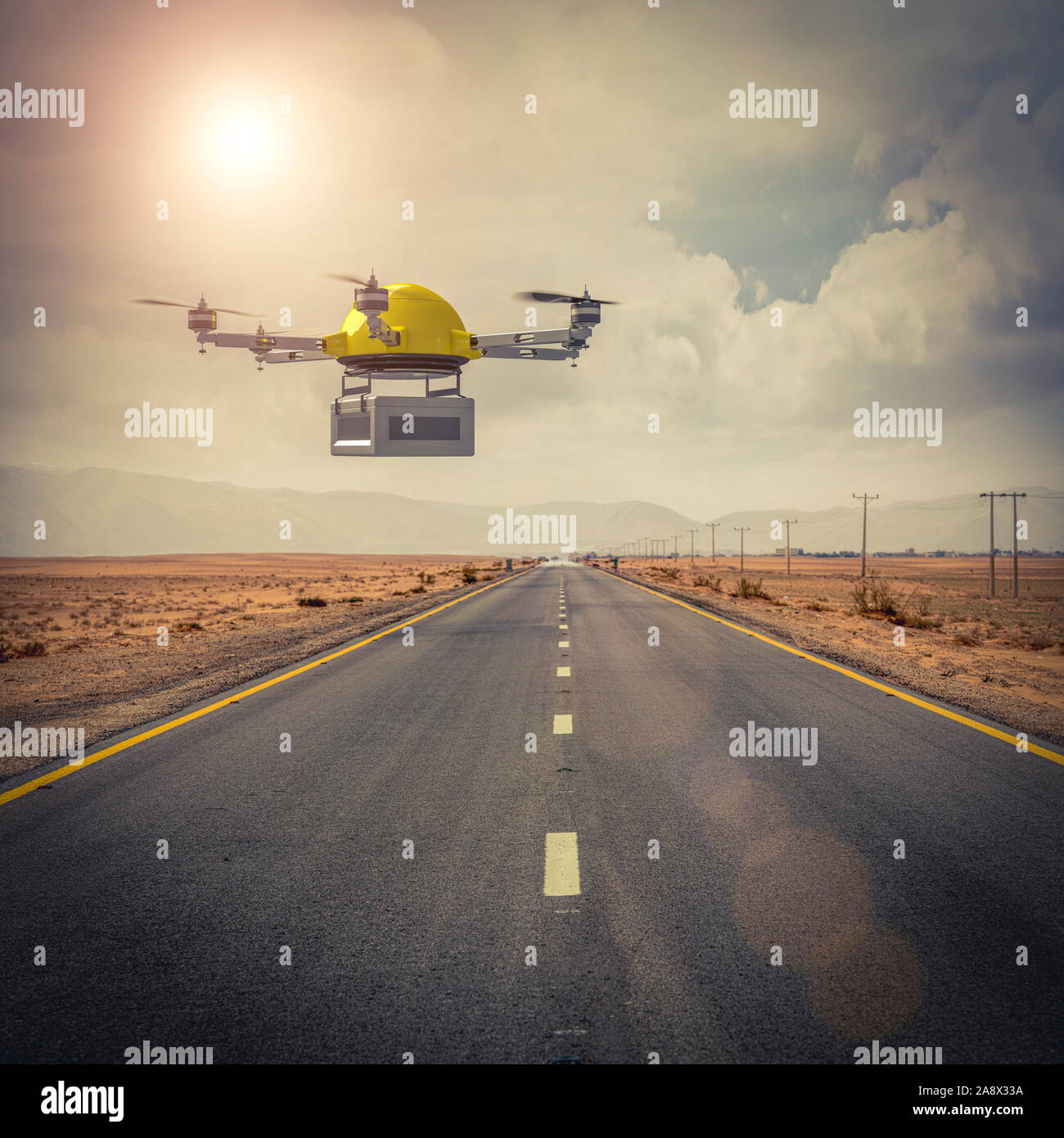 Gelbe drone für Expeditionen fliegt über eine isolierte Straße mitten in der Wüste. Weltweiter Versand Konzept. Stockfoto