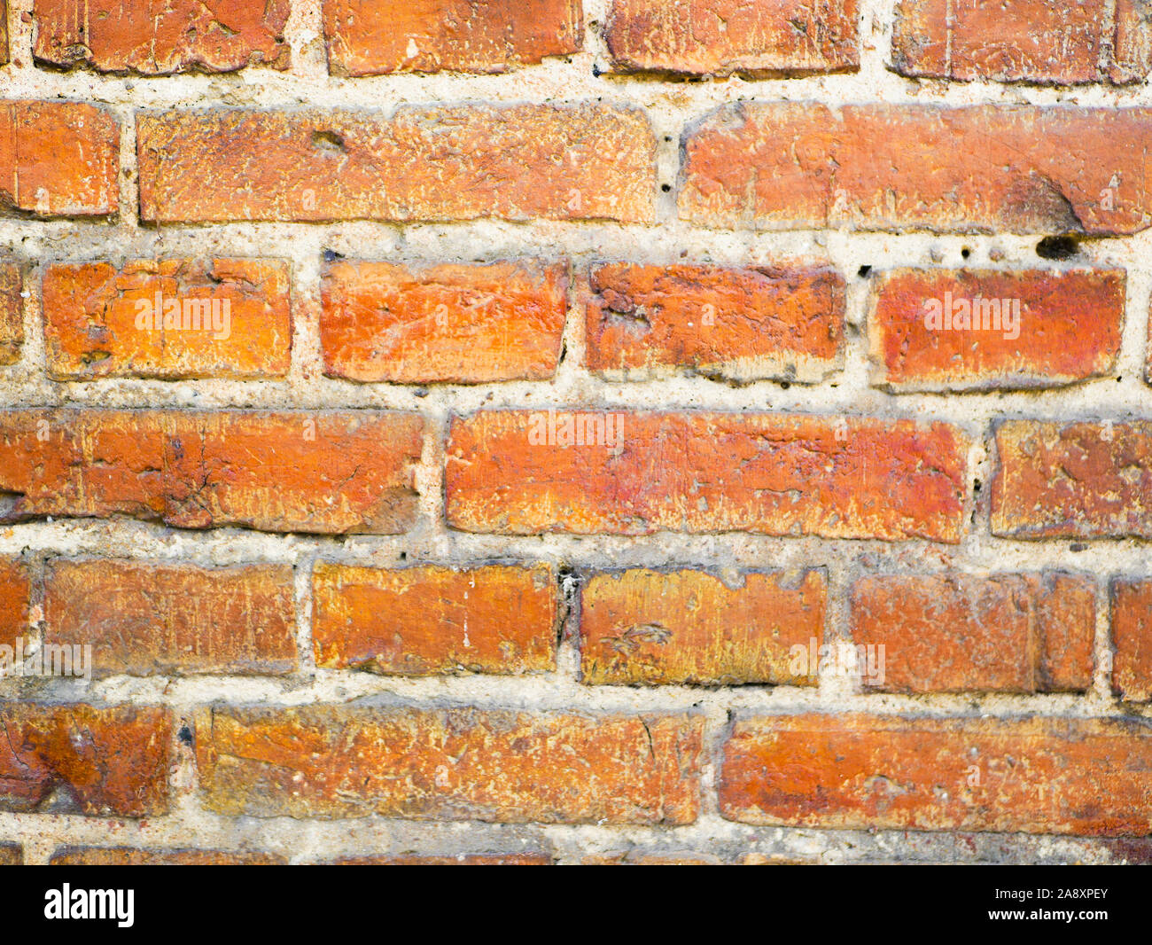 Alte orange brick wall. Bunte alte britische Red brick wall Hintergrund. Close-up Stockfoto