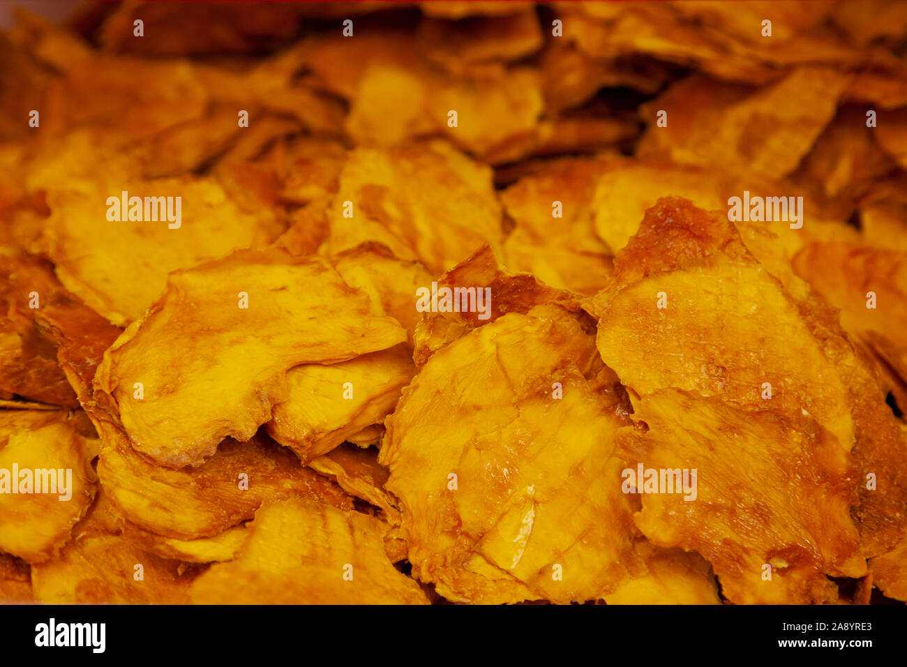 Orange Gelb farbige Scheiben getrocknete mango Obst Stockfoto