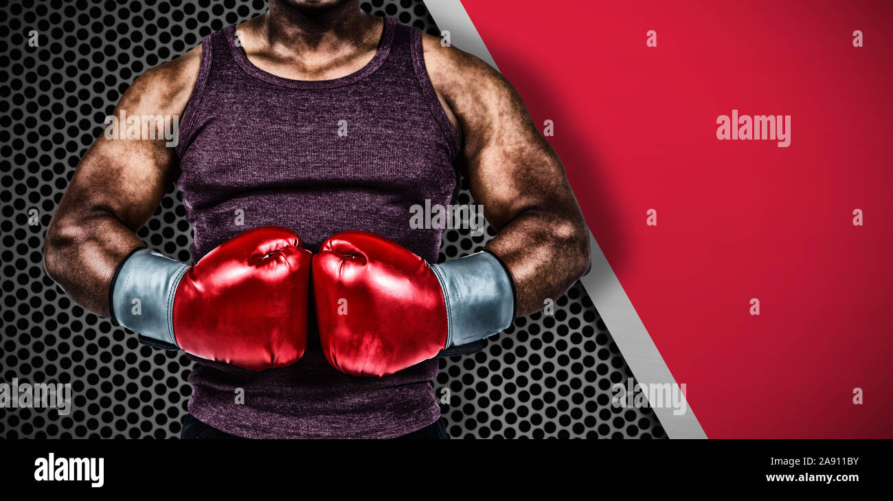 Zusammengesetztes Bild von Fit Mann mit Boxhandschuhen Stockfoto