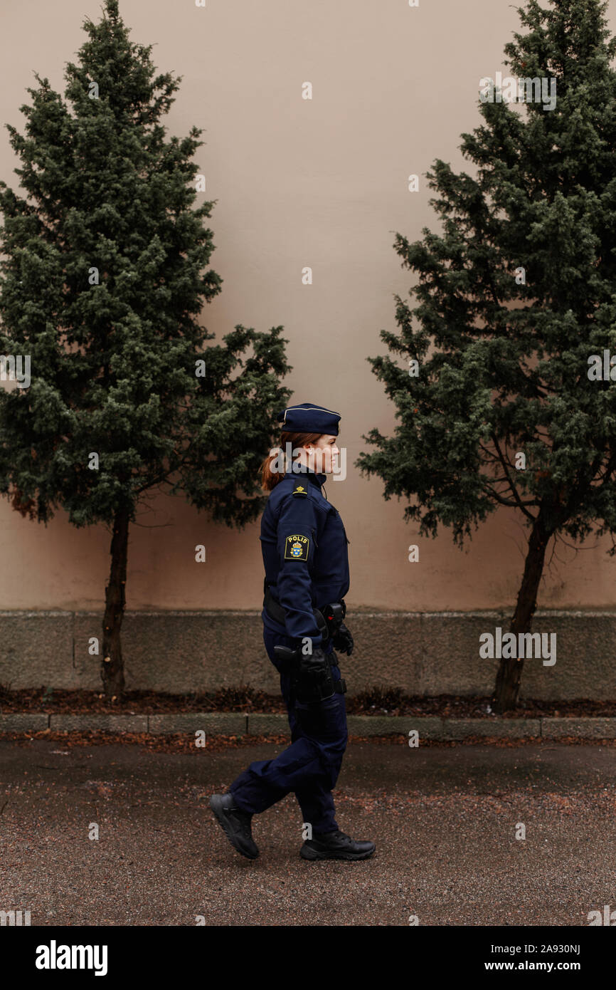 Police Woman walking Stockfoto