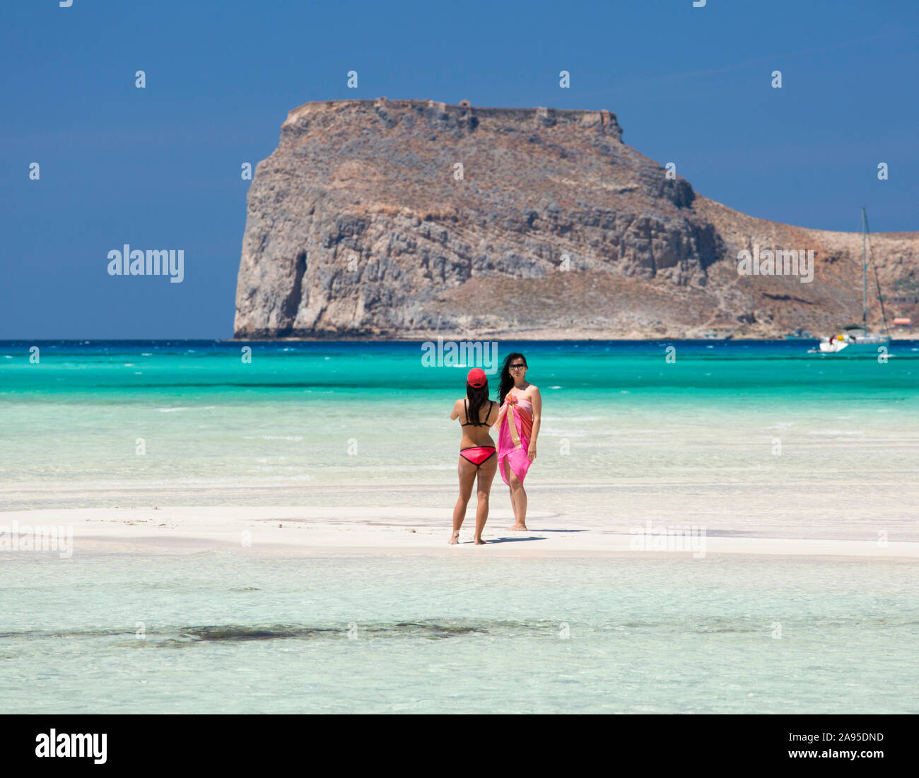 Girls wearing bikini on beach Fotos und Bildmaterial in hoher
