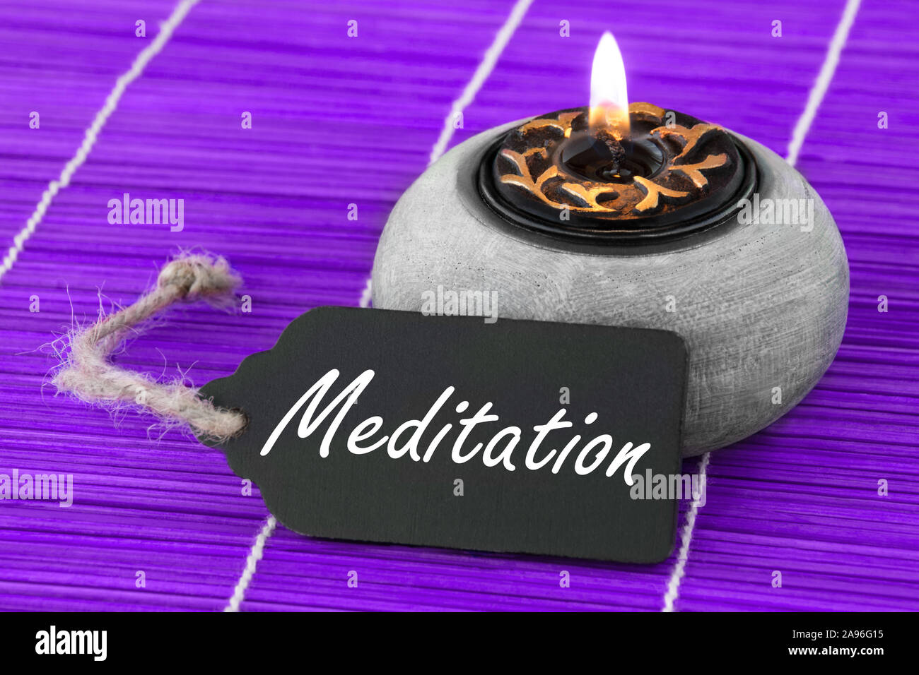 Meditation andle und Label Stockfoto