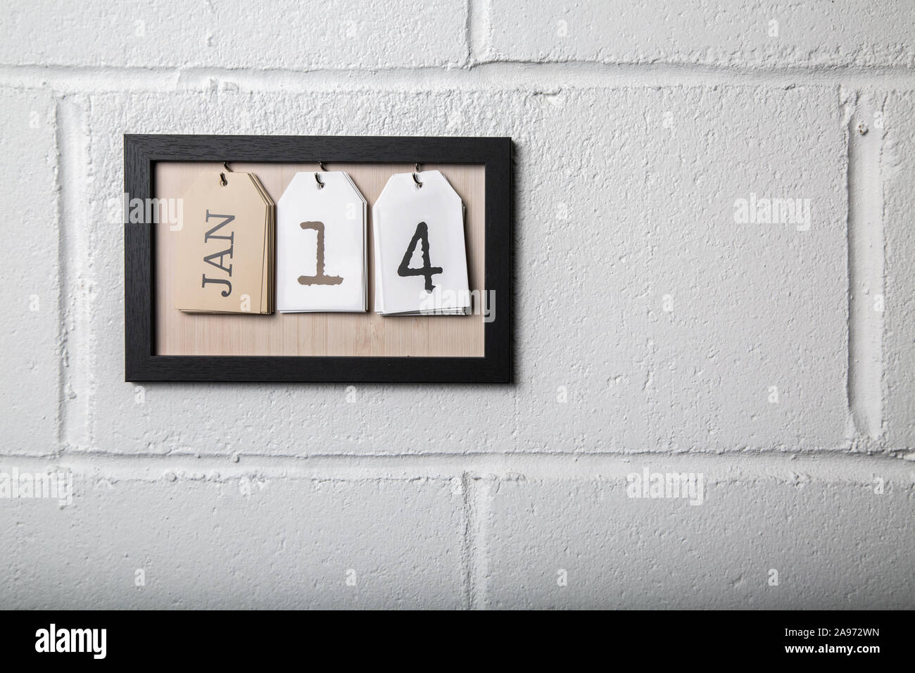 An der Wand hängenden Kalender in einem Bilderrahmen angezeigt. Januar 14. Stockfoto