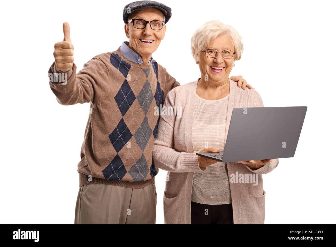 Älterer mann Daumen nach oben zeigt und eine ältere Frau mit einem Laptop auf weißem Hintergrund Stockfoto