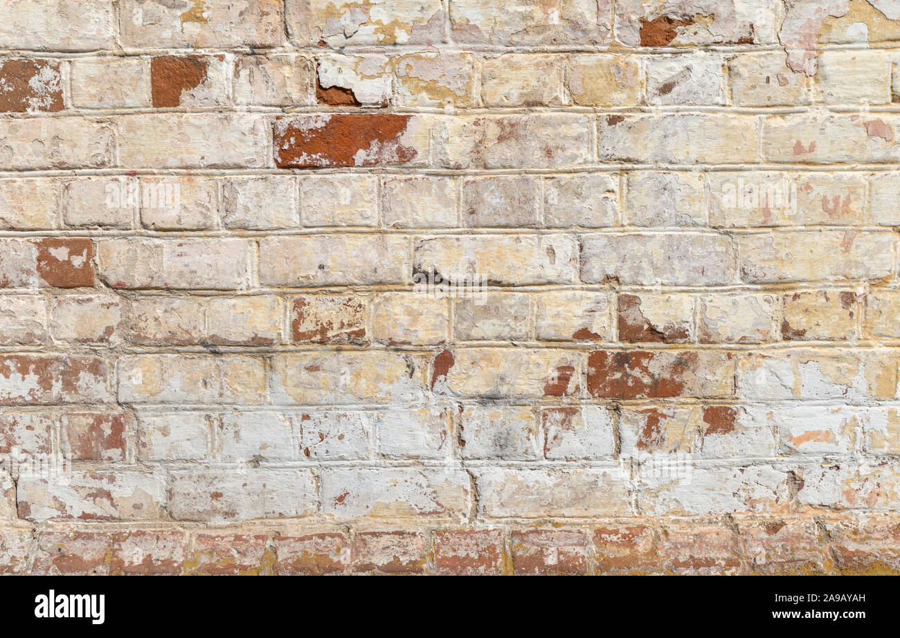 Hintergrund der alten Vintage verschmutzte Ziegelwand mit peeling Putz, Textur Stockfoto