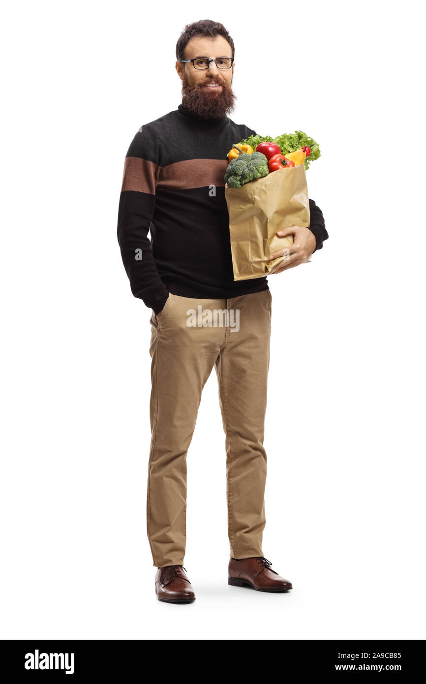 Volle Länge Portrait eines bärtigen Mann mit Lebensmitteln in einer Papiertüte auf weißem Hintergrund Stockfoto