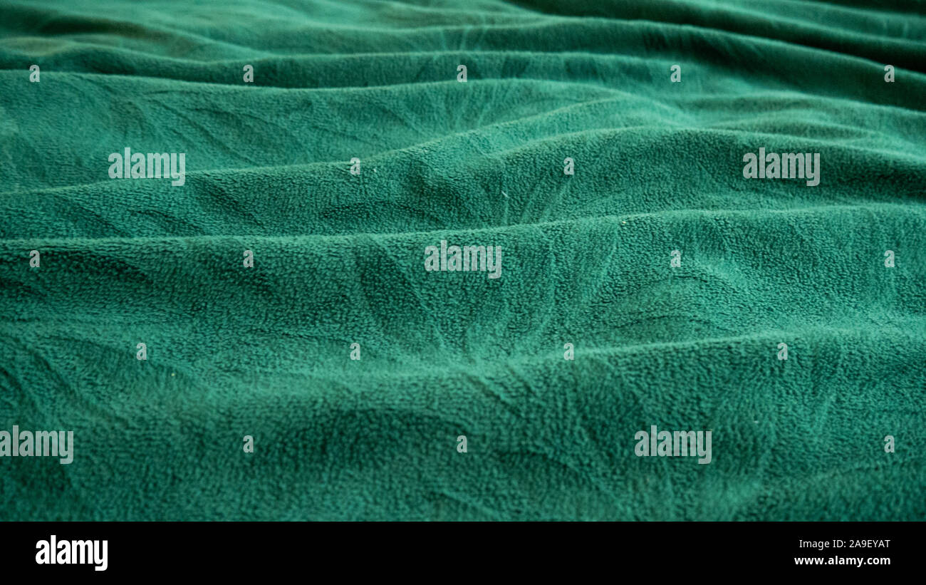 Wellen aus Türkis Gewebe. Schöne Textur Stockfoto