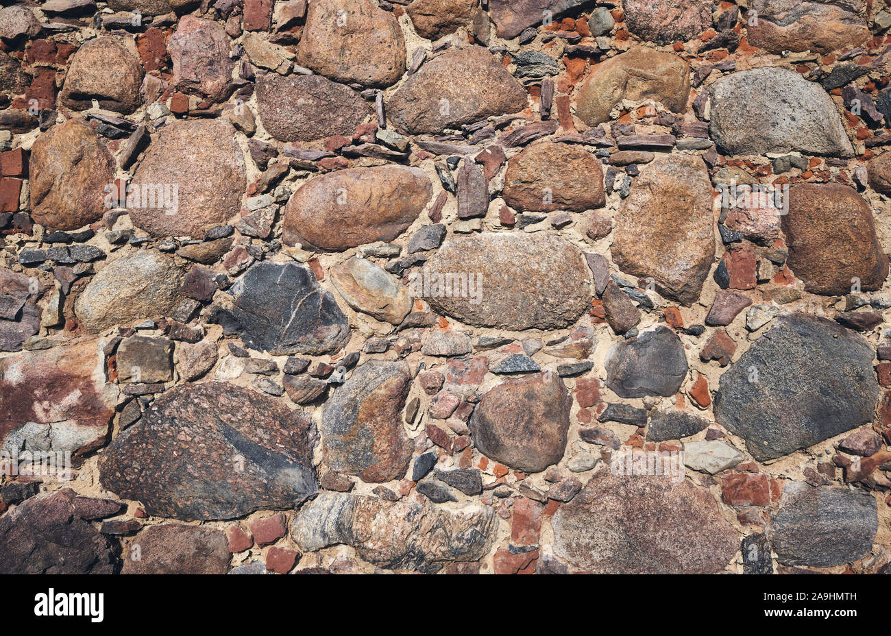 Alte Mauer aus Stein. Stockfoto