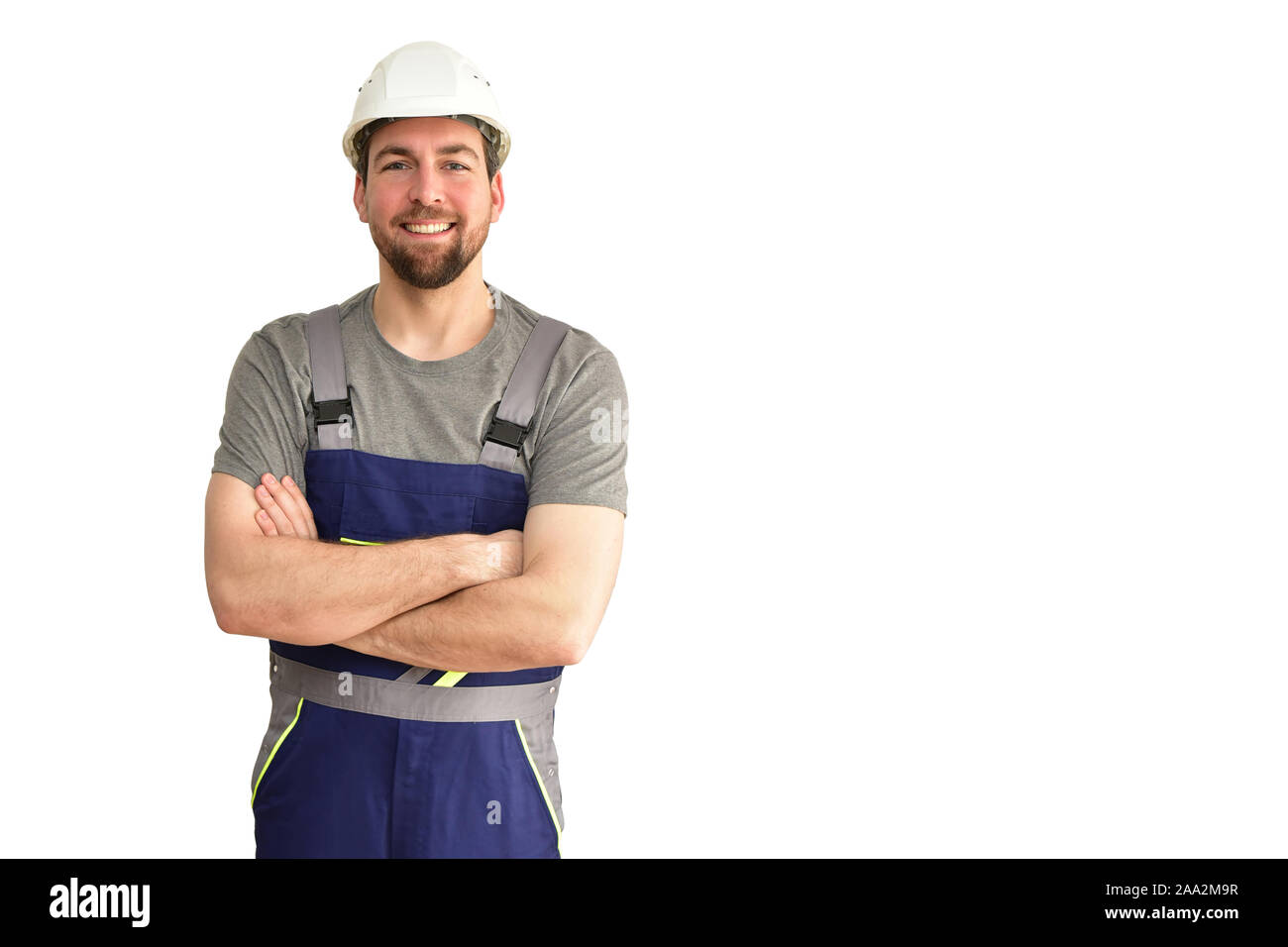 Freundliche Bauarbeiter - Handwerker in Arbeitskleidung auf weißem Hintergrund isoliert Stockfoto