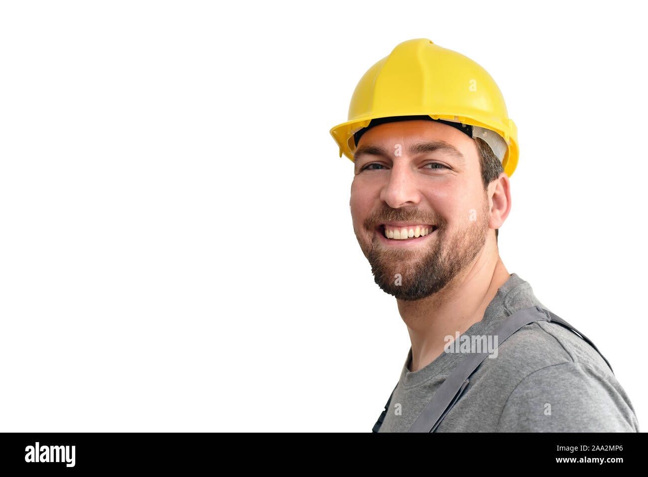 Freundliche Bauarbeiter - Handwerker in Arbeitskleidung auf weißem Hintergrund isoliert Stockfoto