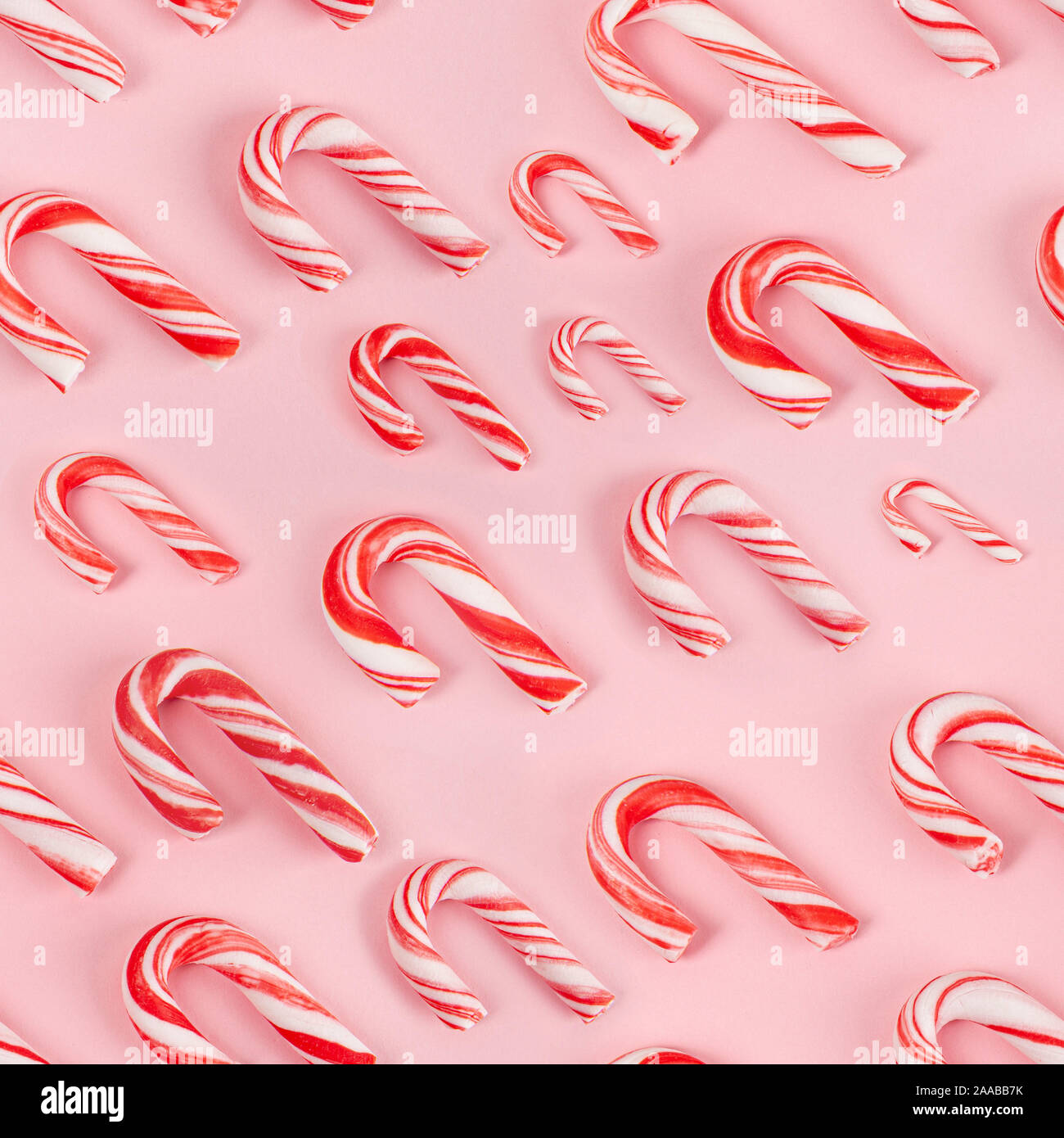 Zuckerstangen auf rosa Hintergrund - nahtlose Muster Stockfoto