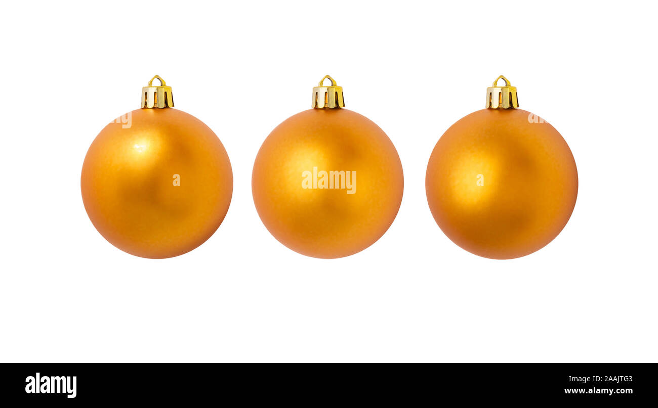 Drei goldene gelbe Weihnachtskugeln mit einer matten Oberfläche auf weißem Hintergrund Stockfoto