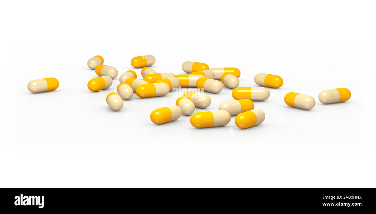 Eine Vielzahl gelber Tabletten vor weissem Hintergrund Stockfoto