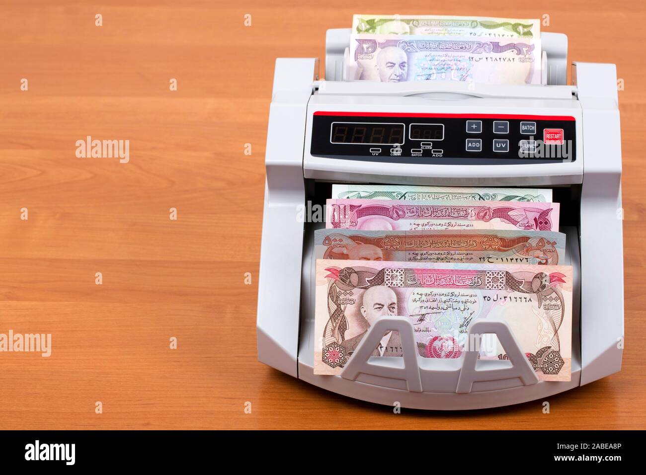 Altes Geld von Afghanistan Afghani in einer zählmaschine Stockfoto