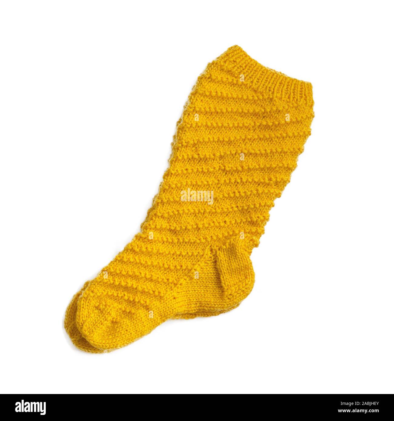 Warm gestrickte gelbe Socke Nahaufnahme. Isolieren Stockfoto