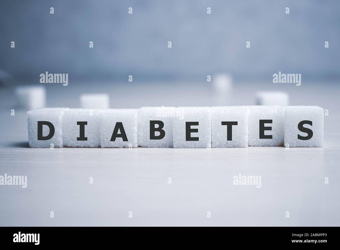 Diabetes Wort im Kreuzworträtsel Stil auf Zucker Blockschrift Hintergrund in der Gesundheitsversorgung und eine gesunde Ernährung Konzept Stockfoto
