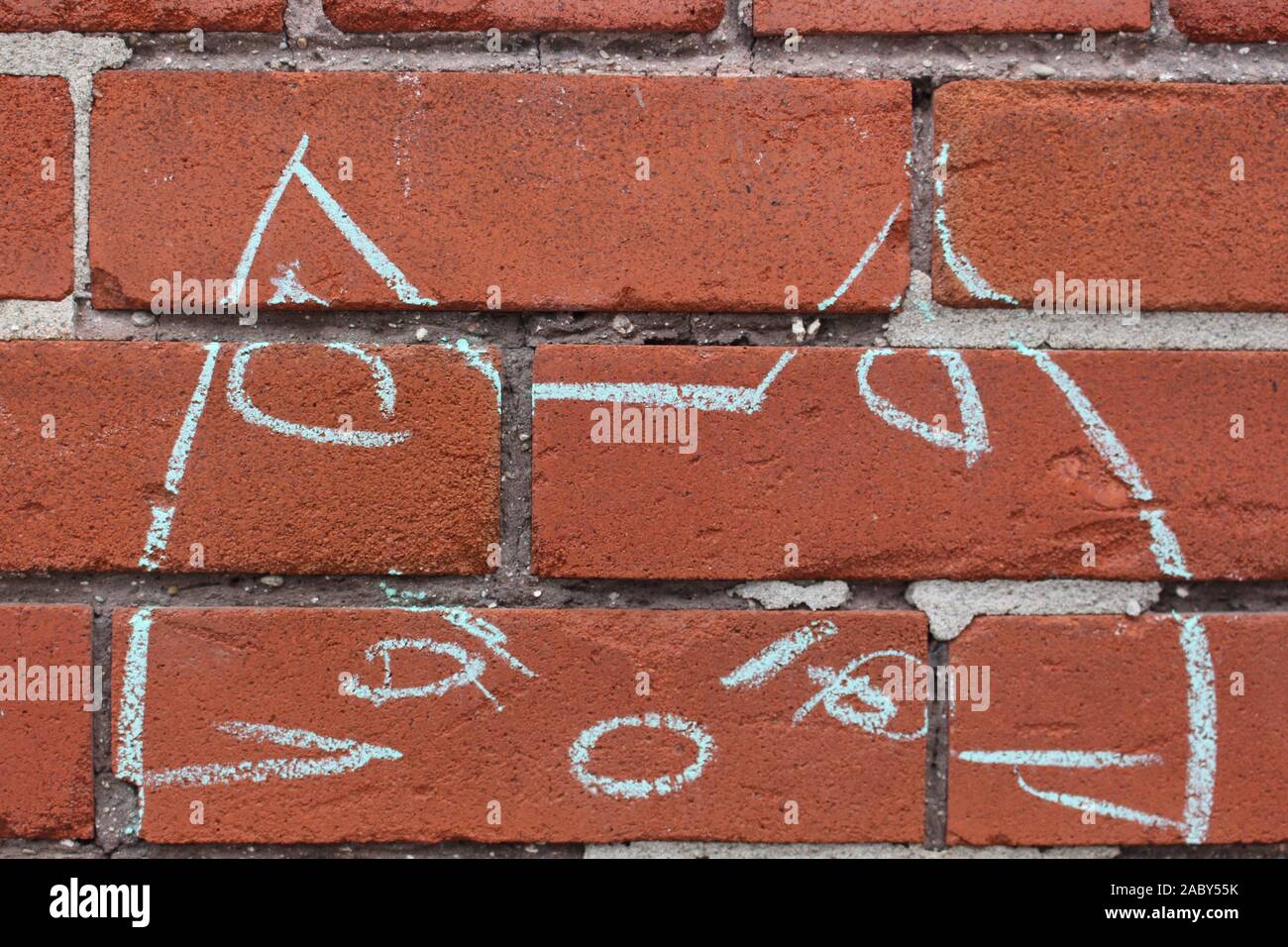 Chalk Katze Kopf Zeichnung auf eine Mauer aus Stein Stockfoto