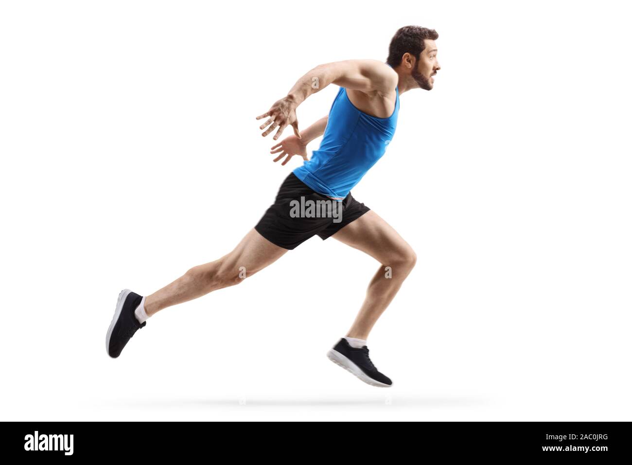 Volle Länge Profil Schuß eines starken, muskulösen Mann schnell auf weißem Hintergrund isoliert Stockfoto
