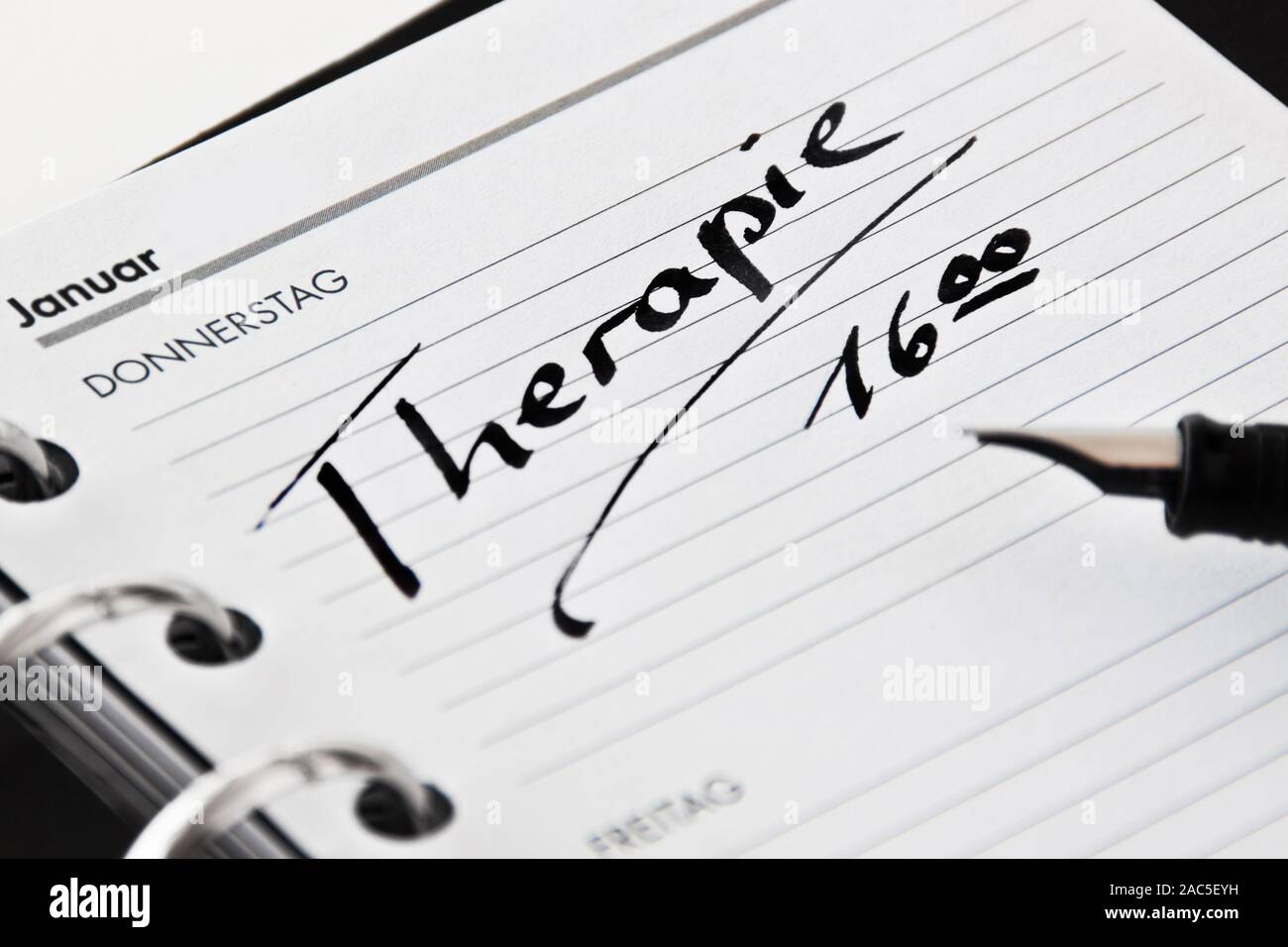 Kalender und Kugelschreiber mit Deutschen: Therapie Stockfoto