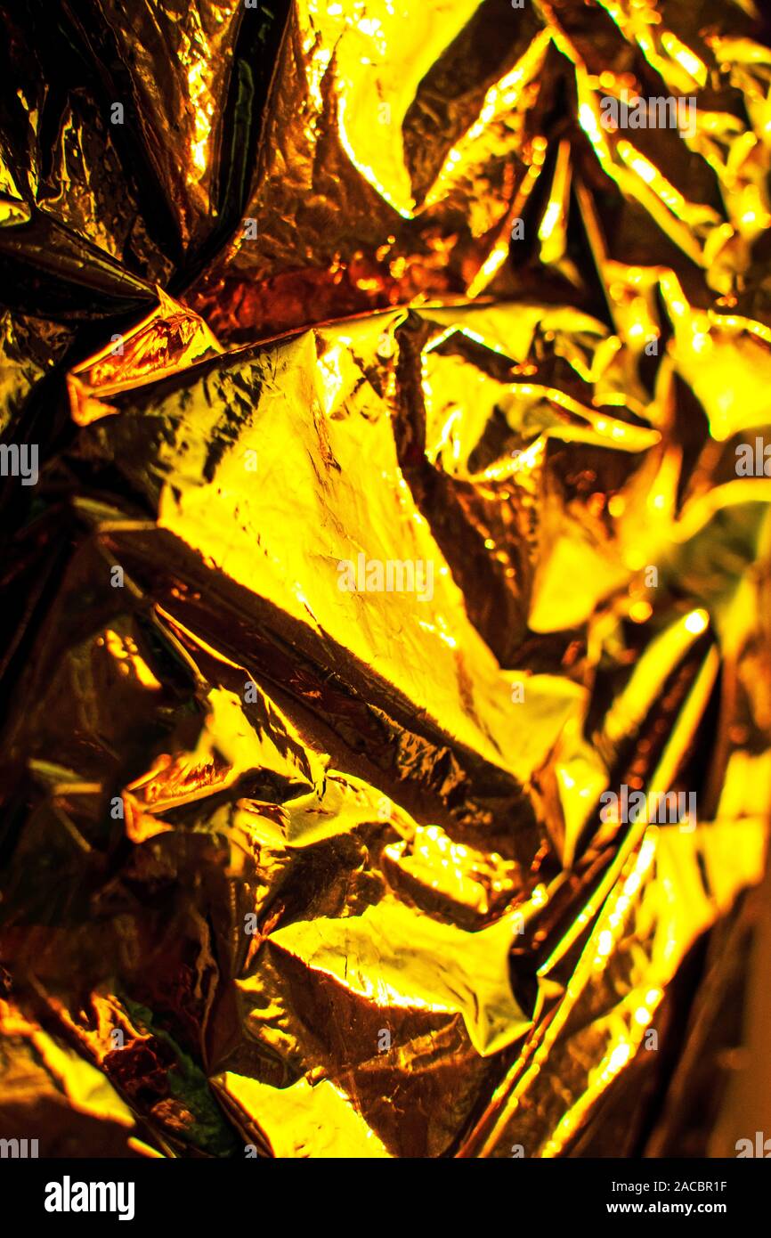 Helle weihnachten Goldener Hintergrund. Glänzend gelb gold Folie Textur. Stockfoto