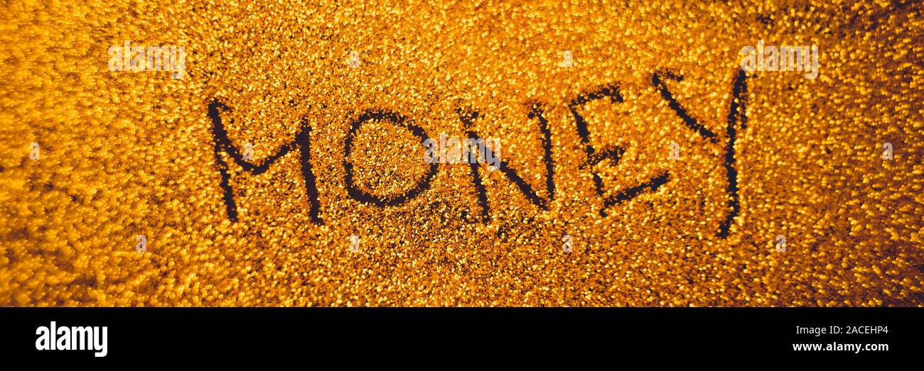 Text Geld auf goldenen Reiche glänzenden Hintergrund. Stockfoto