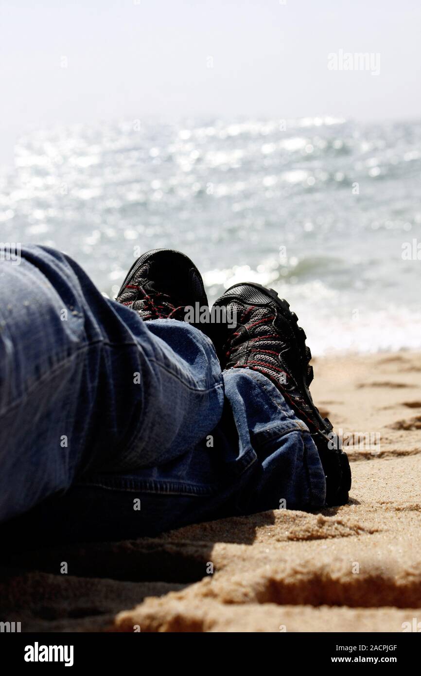 Beine am Strand Stockfoto