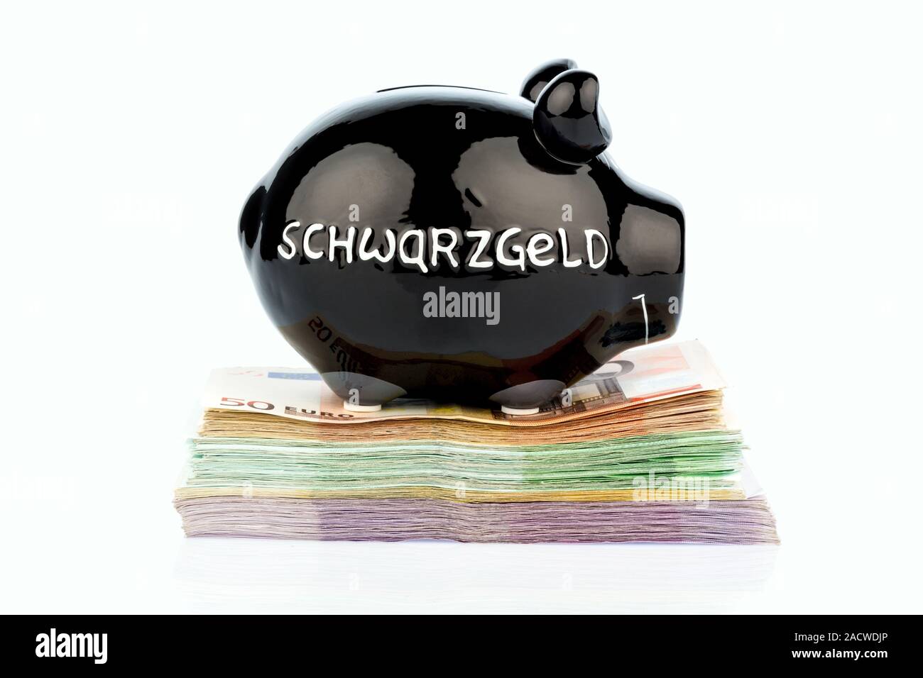 Schwarz Sparschwein auf Geld Stockfoto
