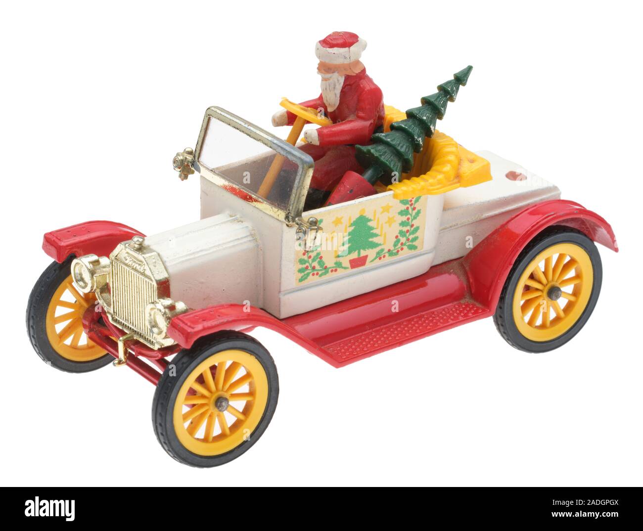 Vater Weihnachten in einem alten Ford Motor Auto. Dinky metall Spielzeug mit Santa und einen Weihnachtsbaum. Stockfoto