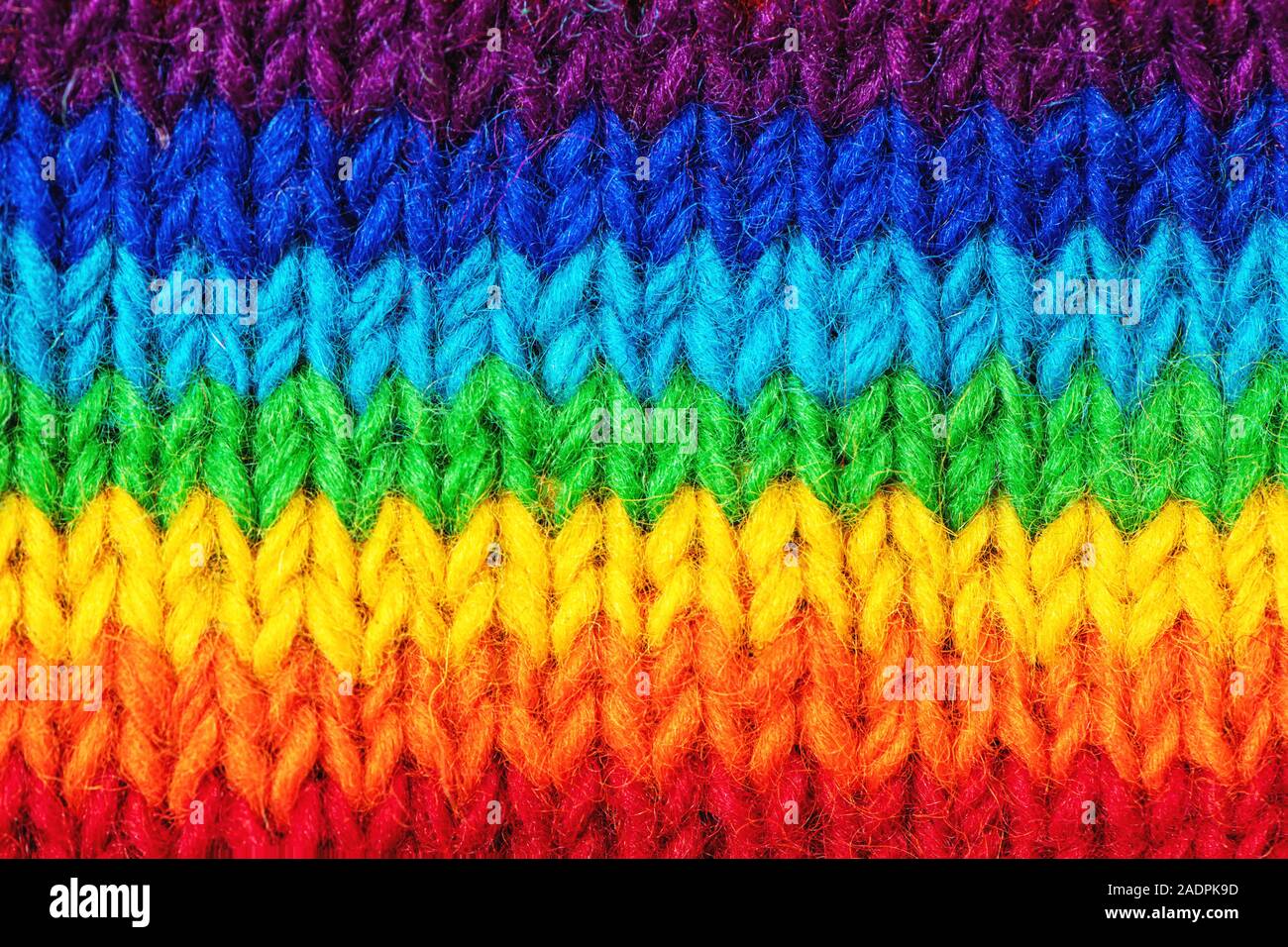 Makro Hintergrund mit hellen Pullover Muster in Regenbogenfarben. Stockfoto
