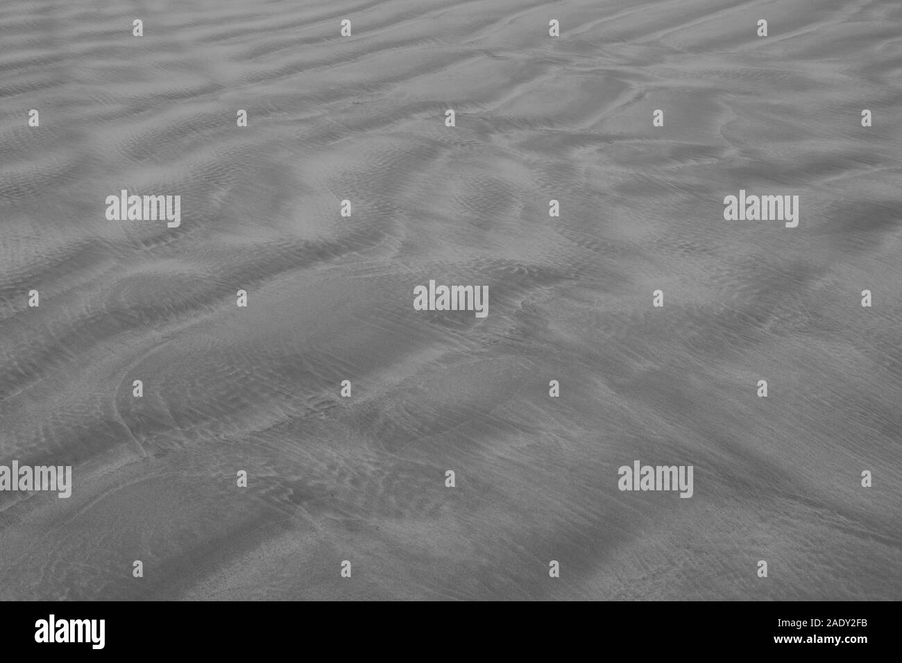 Strand Sand Textur in Graustufen Stockfoto