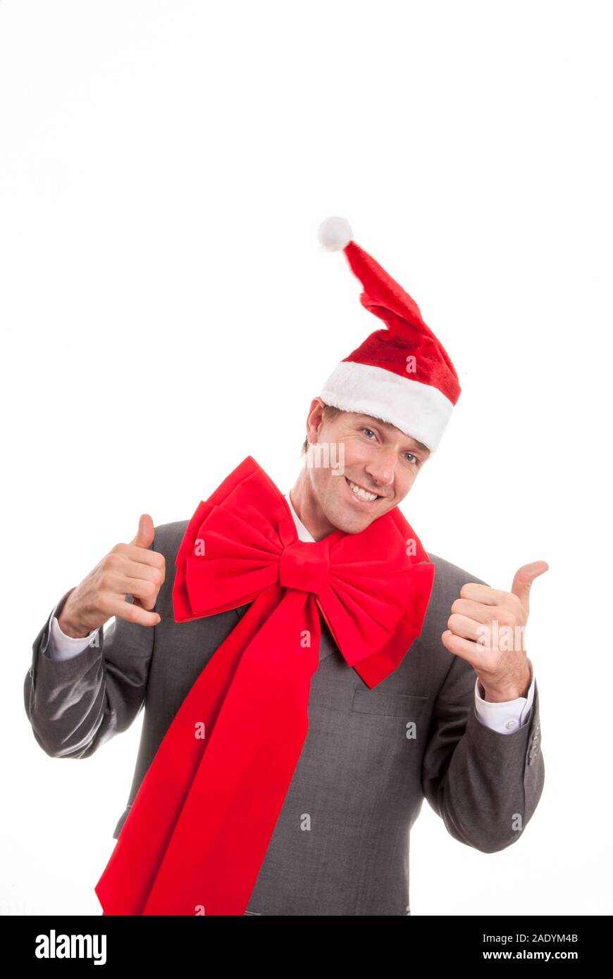 Lächeln, Geschäftsmann, tragen, Santa Hut und passenden großen hellen roten Urlaub Bogen zwei Daumen oben auf weißem Hintergrund Stockfoto