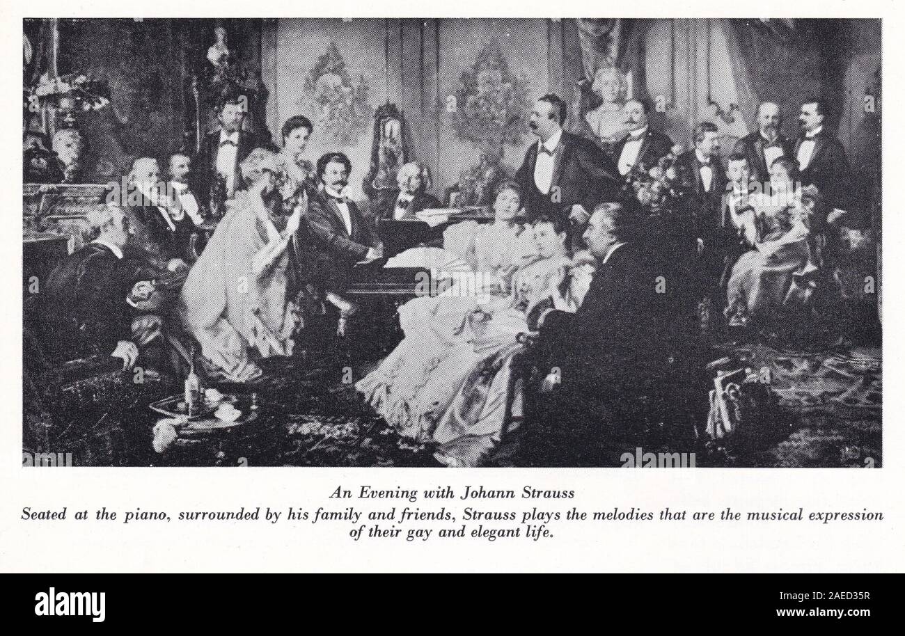 Johann Strauss II - "Ein Abend mit Johann Strauss' sitzt am Klavier von der Familie und von Freunden umgeben. Stockfoto