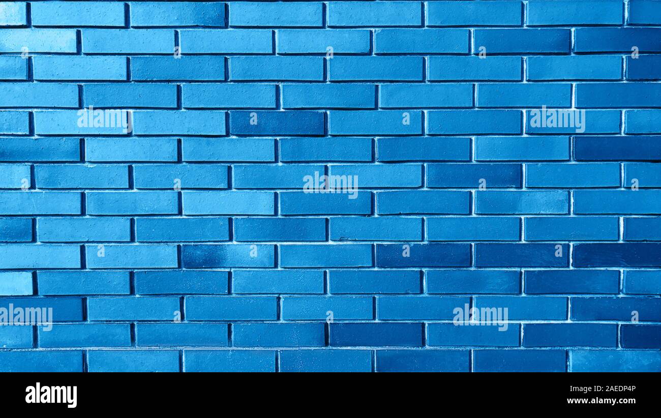Blauer Hintergrund aus Ziegel wand Textur muster, Wallpaper Design vorlage. Classic blau Farbe ist die Farbe des Jahres 2020. Stockfoto