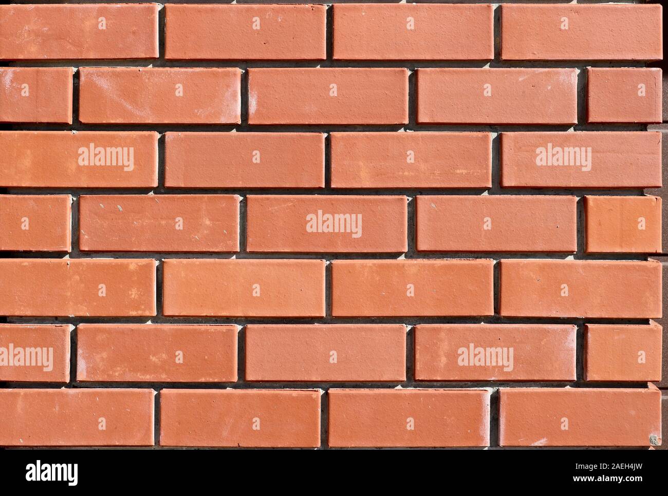Die Struktur des neuen Mauerwerk. Ziegel Hintergrund für das Template. Brick Wall. Close-up. Stockfoto