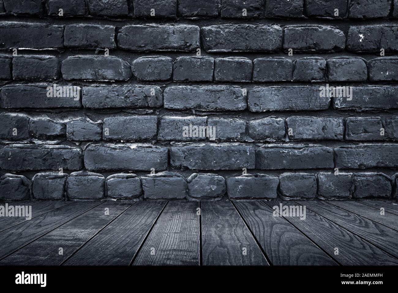 Licht und Dunkel Grau Steine an der Wand und Holzboden Dekoration für Hintergrund. Stockfoto