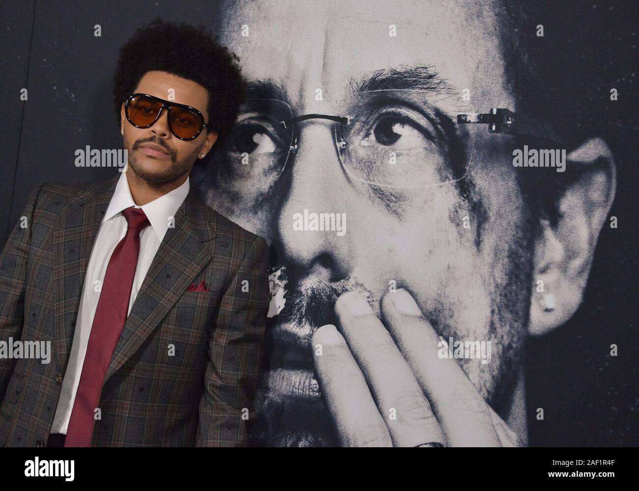 Los Angeles, USA. 11 Dez, 2019. Die Weeknd kommt an der UNGESCHNITTENEN EDELSTEINE Los Angeles Premiere am ArcLight Cinerama Dome in Los Angeles, CA am Mittwoch, 11. Dezember 2019 statt. (Foto durch Sthanlee B. Mirador/Sipa USA) Credit: Sipa USA/Alamy leben Nachrichten Stockfoto