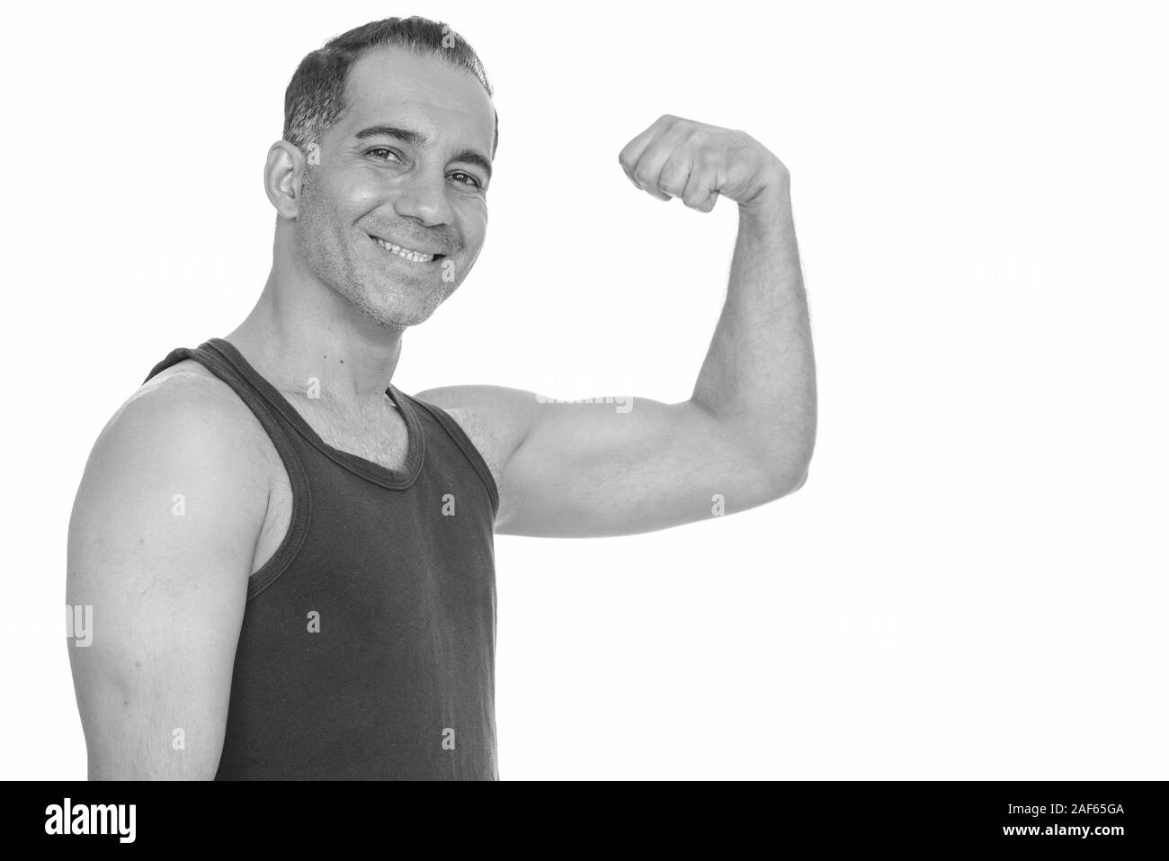 Reifen glücklich Persischen Mann verbiegen Arm für Fitnessraum flexing Arm bereit Stockfoto