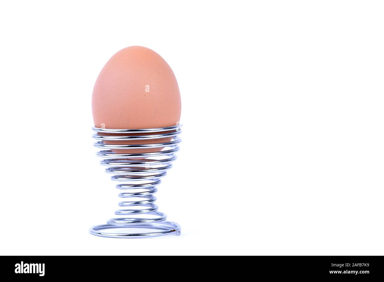 Braunes in Designereierbecher Huehnerei Stockfoto