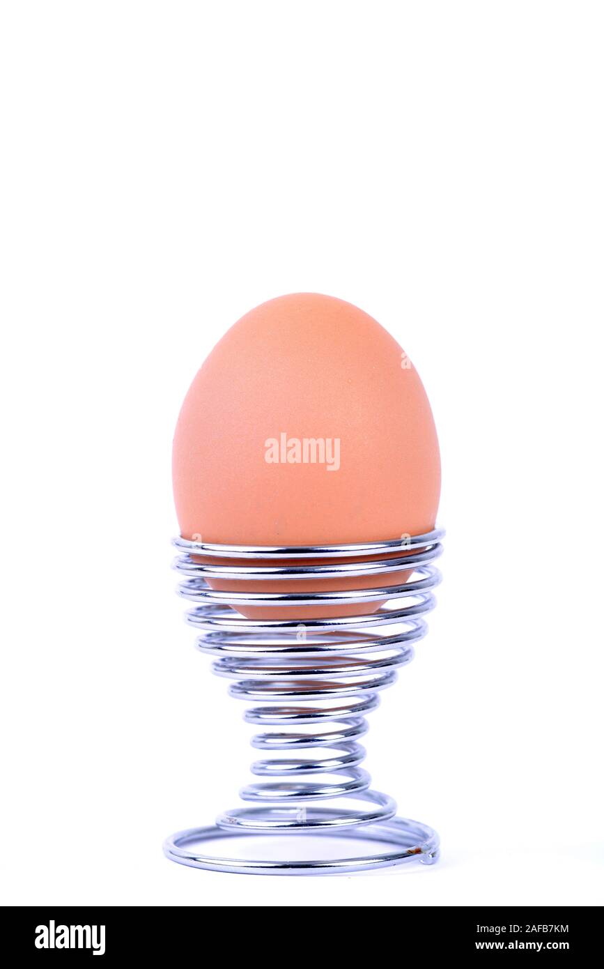 Braunes in Designereierbecher Huehnerei Stockfoto