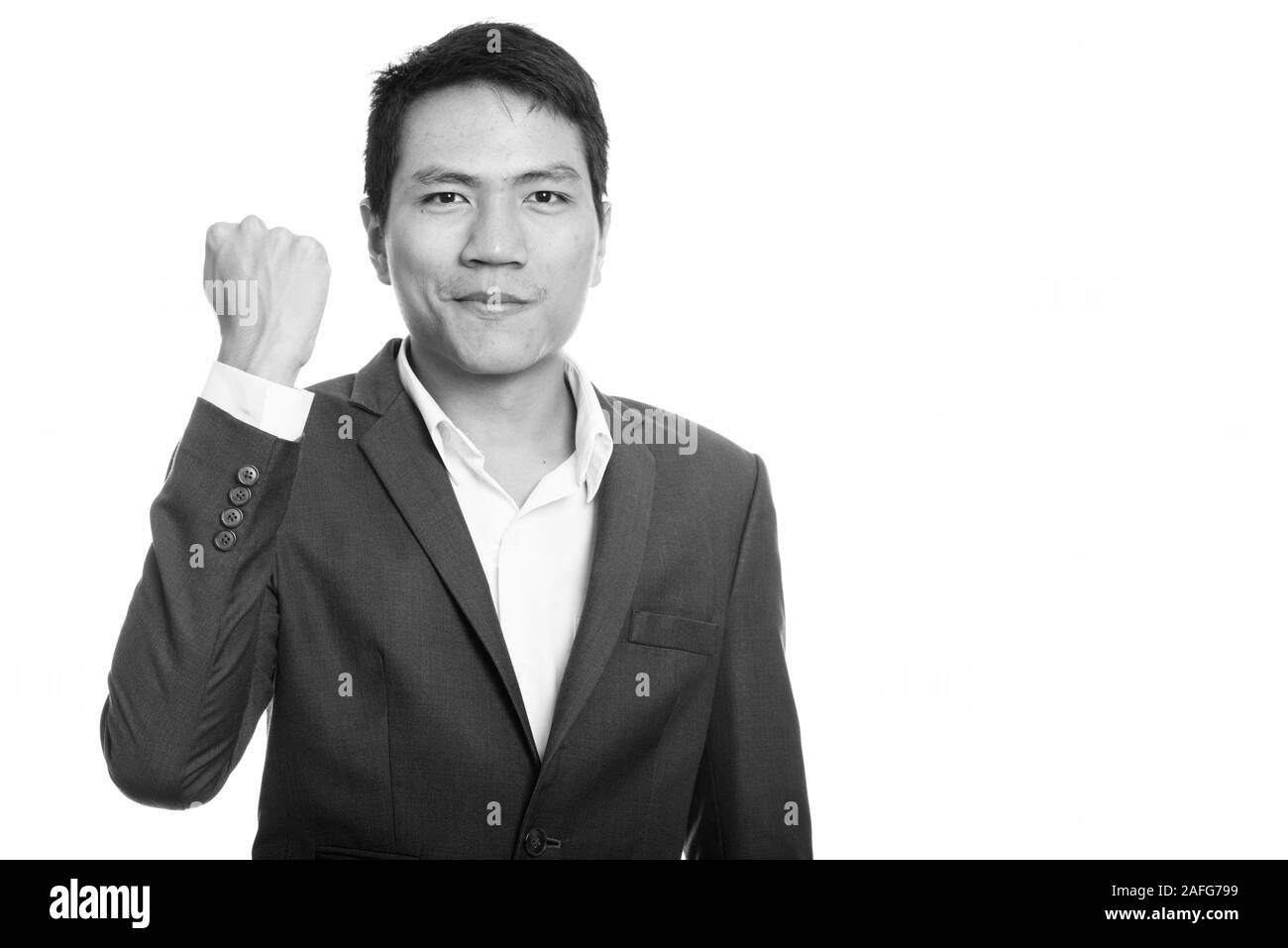 Studio geschossen von jungen asiatischen Geschäftsmann motiviert suchen Stockfoto