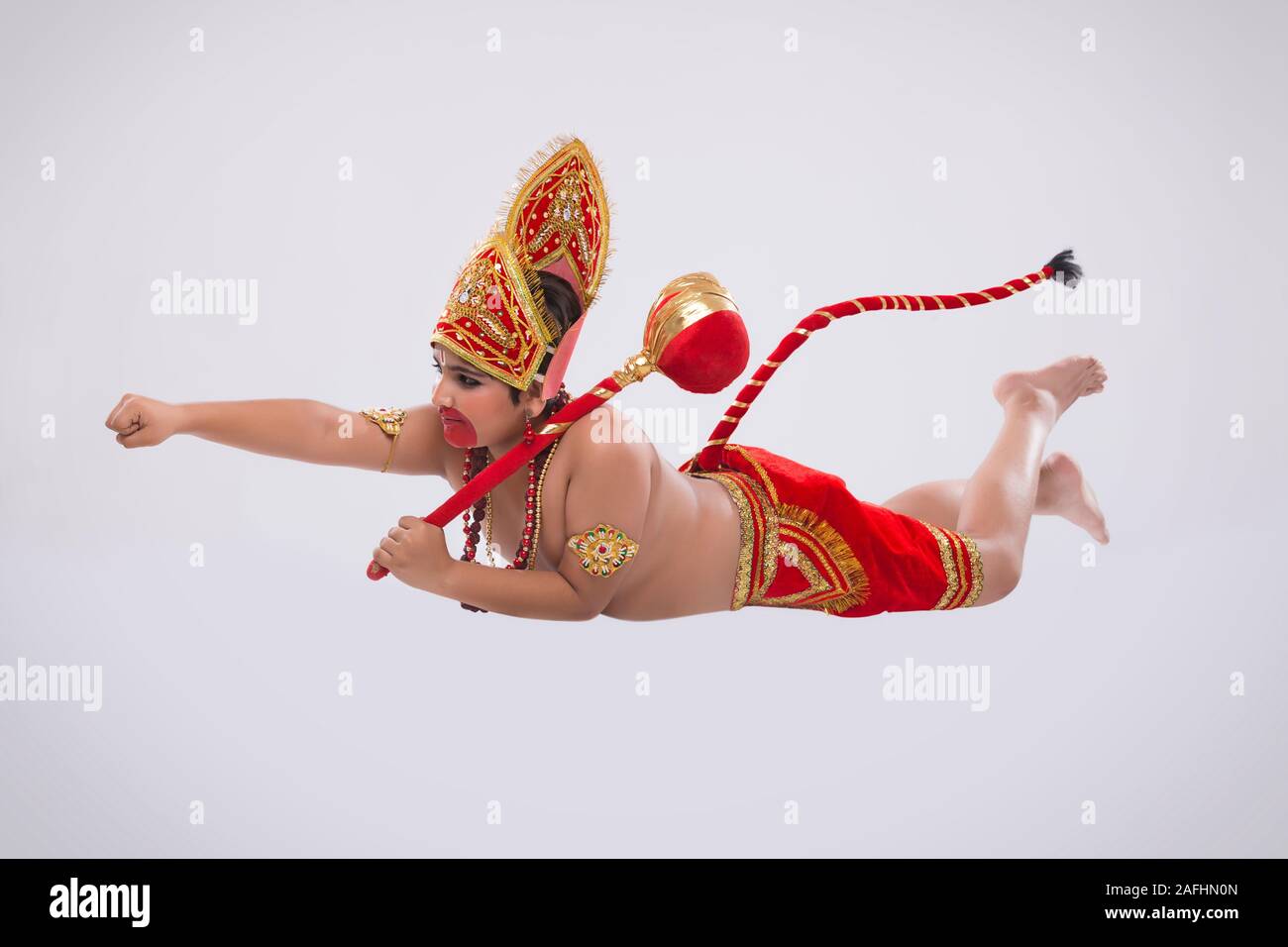 Kind verkleidet als hanuman in Luft Stockfoto