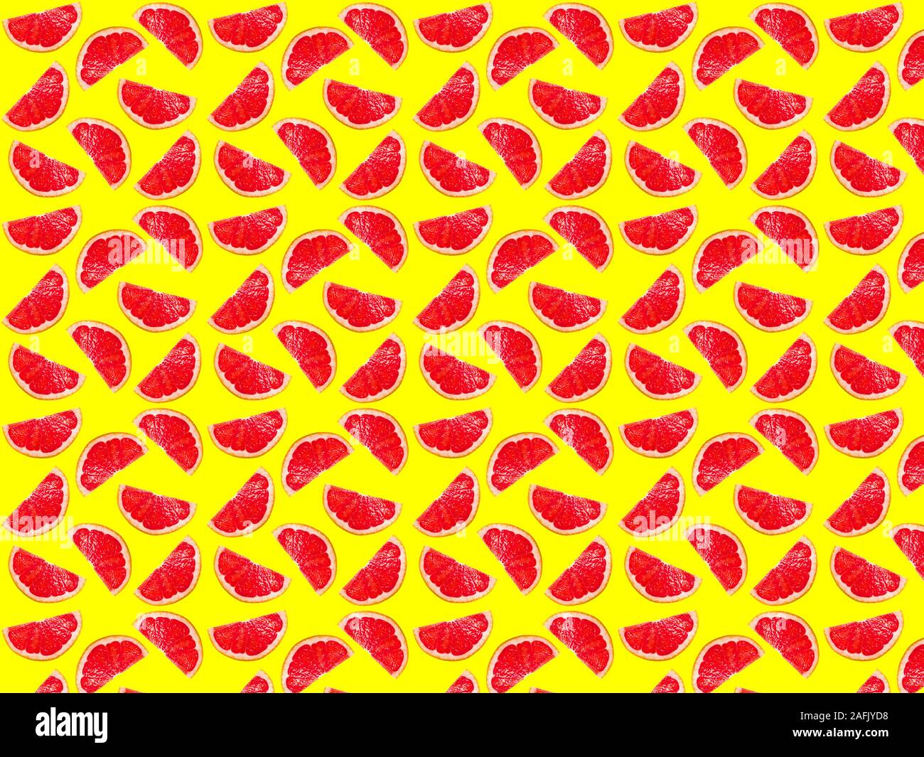 Nahtlose foto Muster der Pampelmuse Scheiben auf einem gelben Hintergrund. Nahtlose Muster für Ihr Design. Stockfoto